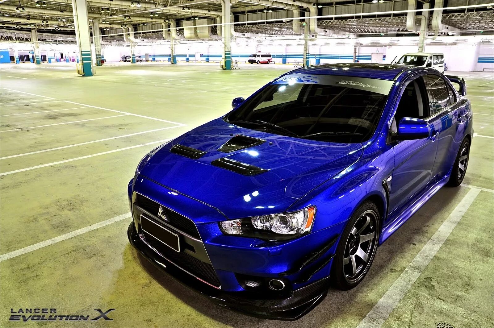 Эво карс симферополь. Mitsubishi Lancer Evolution 10 Blue. Лансер Эволюшн 10 темно синий. Лансер 10 Эво синий. Mitsubishi Lancer Evolution 10 синий.