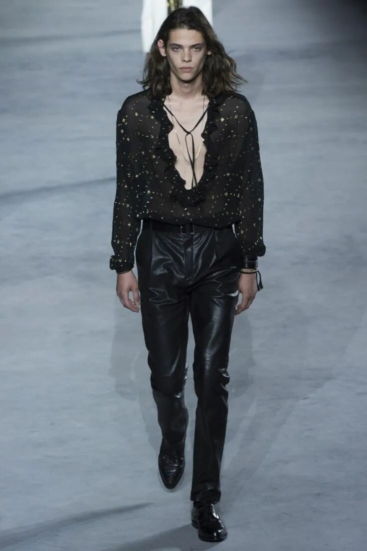 S laurent. Abraham wears, striped sweater yproject black jeanis saint laurent by anthony vaccarello.