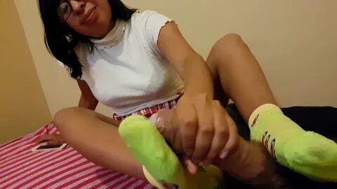 Handjob, sockjob, and massive cumshot on Latina feet in socks. 