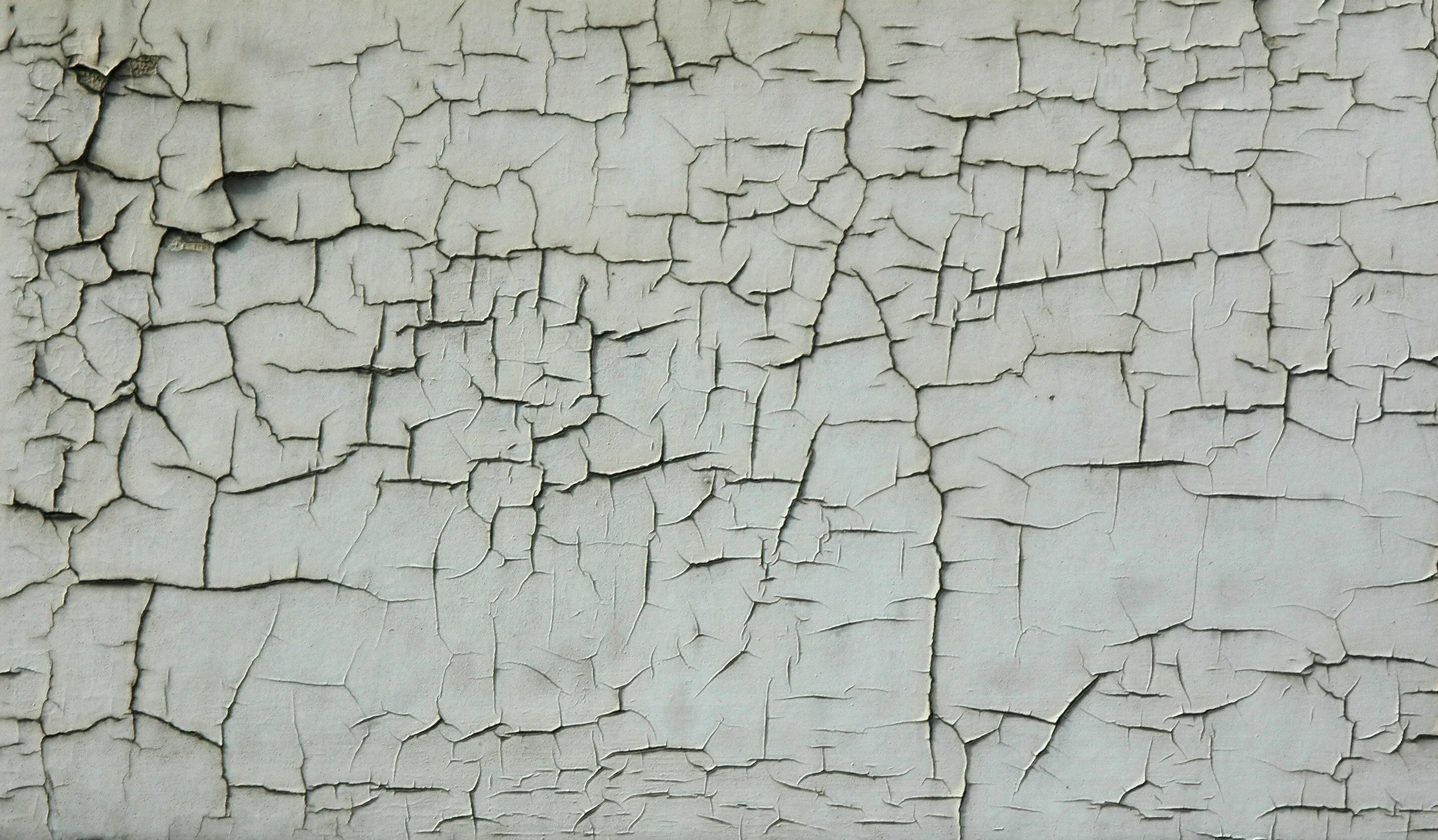 Текстура потрескавшейся краски. Фактура стены. Трещина в стене. Стена потрескавшаяся штукатурка.