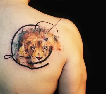 Lion tattoo on shoulder blade