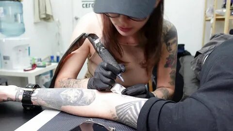 Fucked in the tattoo studio of a sexy tattoo artist! 