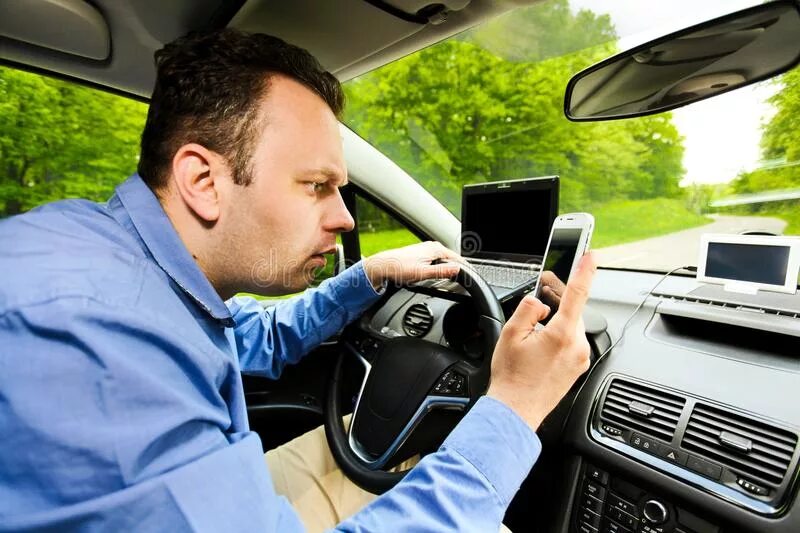 Fixes his car. Водитель и GPS. The Lost Driver. Moving somewhere by car. GPS using stock photo.