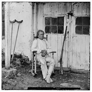 John L. Burns, the "old hero of Gettysburg," with gun and crutche...