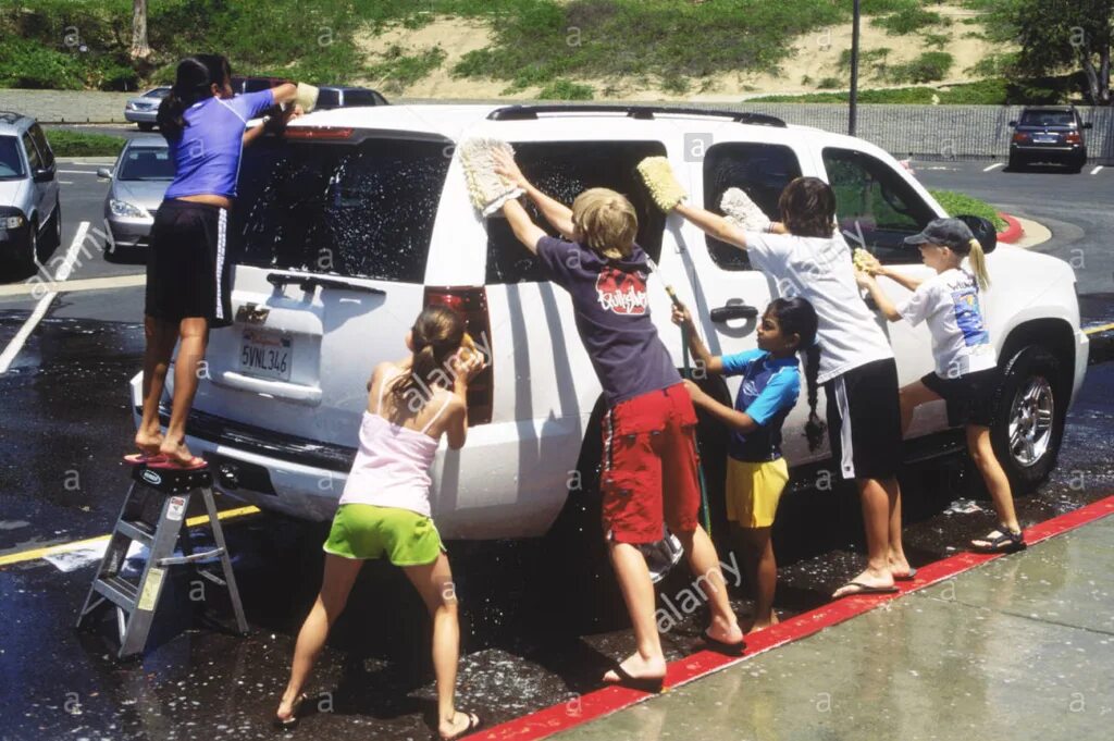 The car is being washed. Car wash’s secret to success? 35 autistic employses.