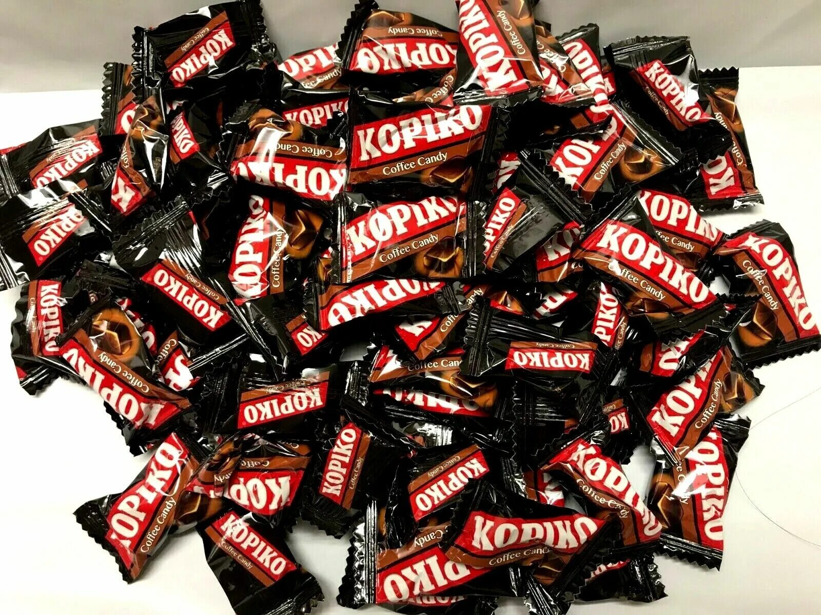 Копико конфеты. Кофейные конфеты Kopiko. Конфеты Копико капучино. Леденцы Копико. Конфеты кофе кэнди