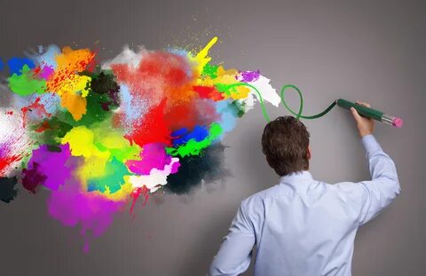 Businessman painting abstract colorful design on gray background concept fo...