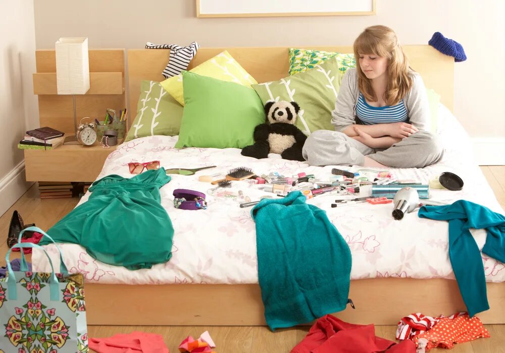 She is tidying her room. She is tidying her room. She is tidying her room. Clean my room. She is tidying her room.