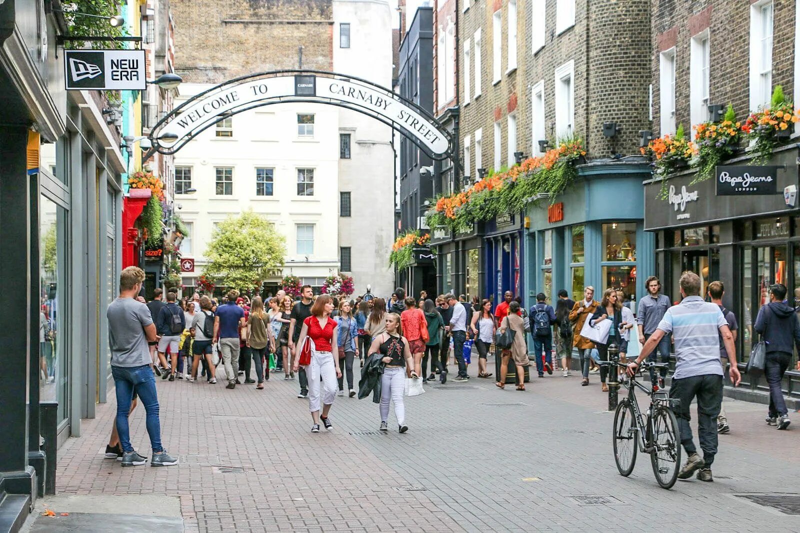 The is located in street near the. Карнаби стрит Лондон. Carnaby Street (London, England). Район Carnaby London. Carnaby Street in London.