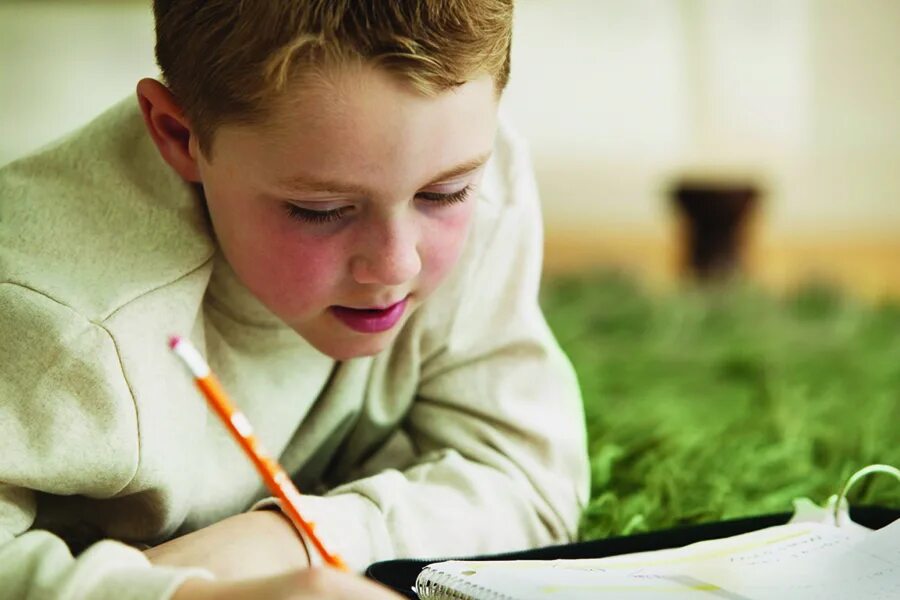 Child focus. Focus on Kids. Do homework photo for teenagers. Study Kid Focused. Boy doing homework.