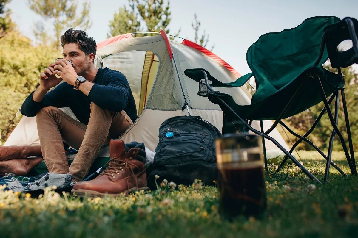 Camping men. Hobo in a Tent. Sleep in the Tent Summer.