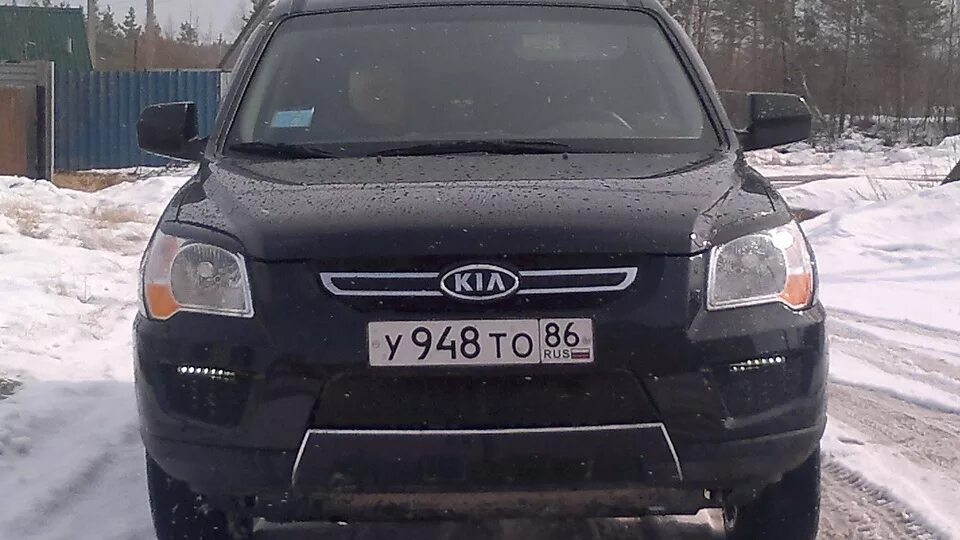 Киа Спортейдж 2009 2.0 дизель. Киа Спортейдж 2 черный. Kia Sportage 2 с чёрной маской фар. Kia Sportage 2009 тонировка.