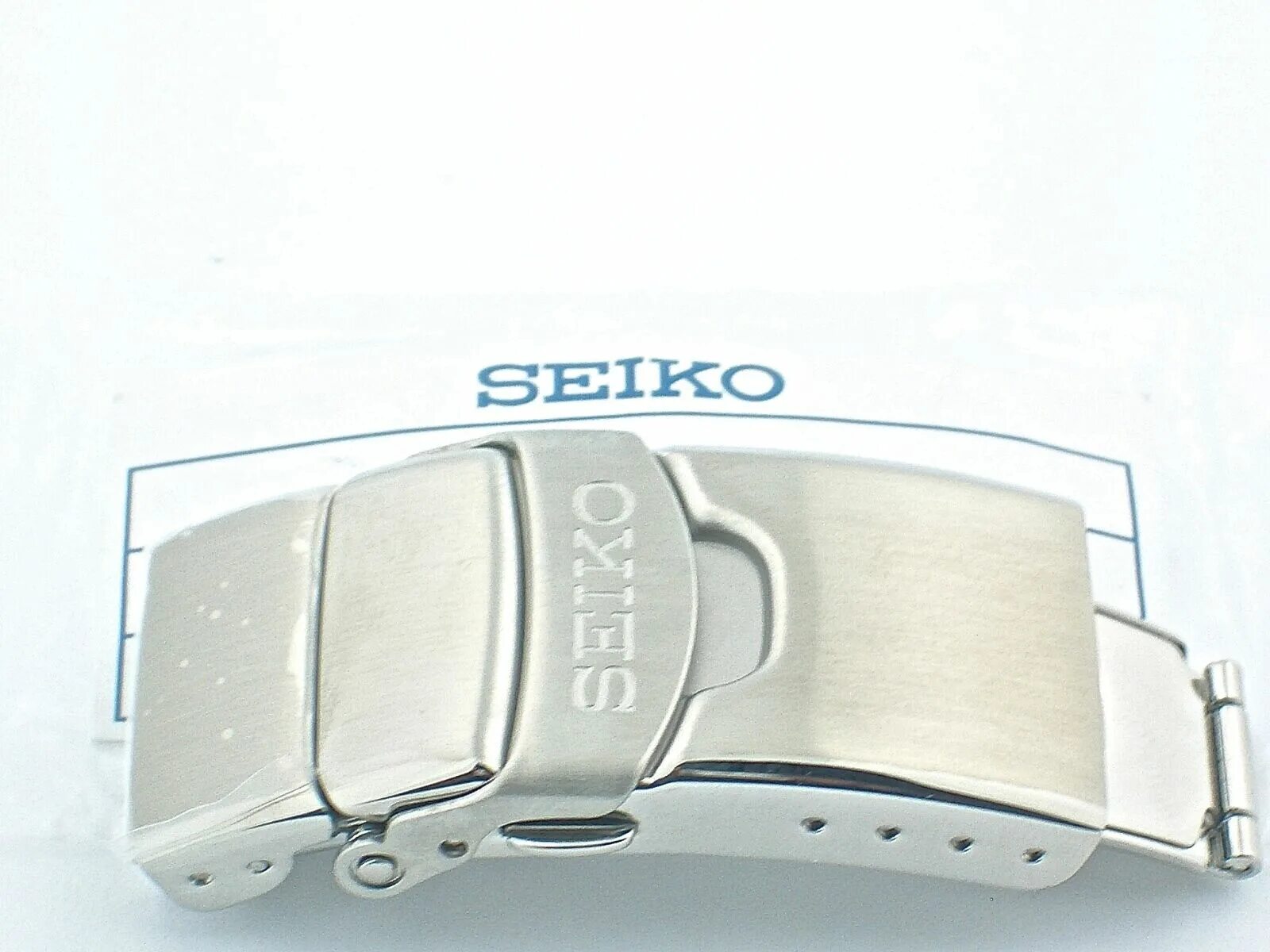 Seiko 20. Ремешок Seiko 20 мм. Застёжка Seiko r047011j0. Литая застежка Seiko.