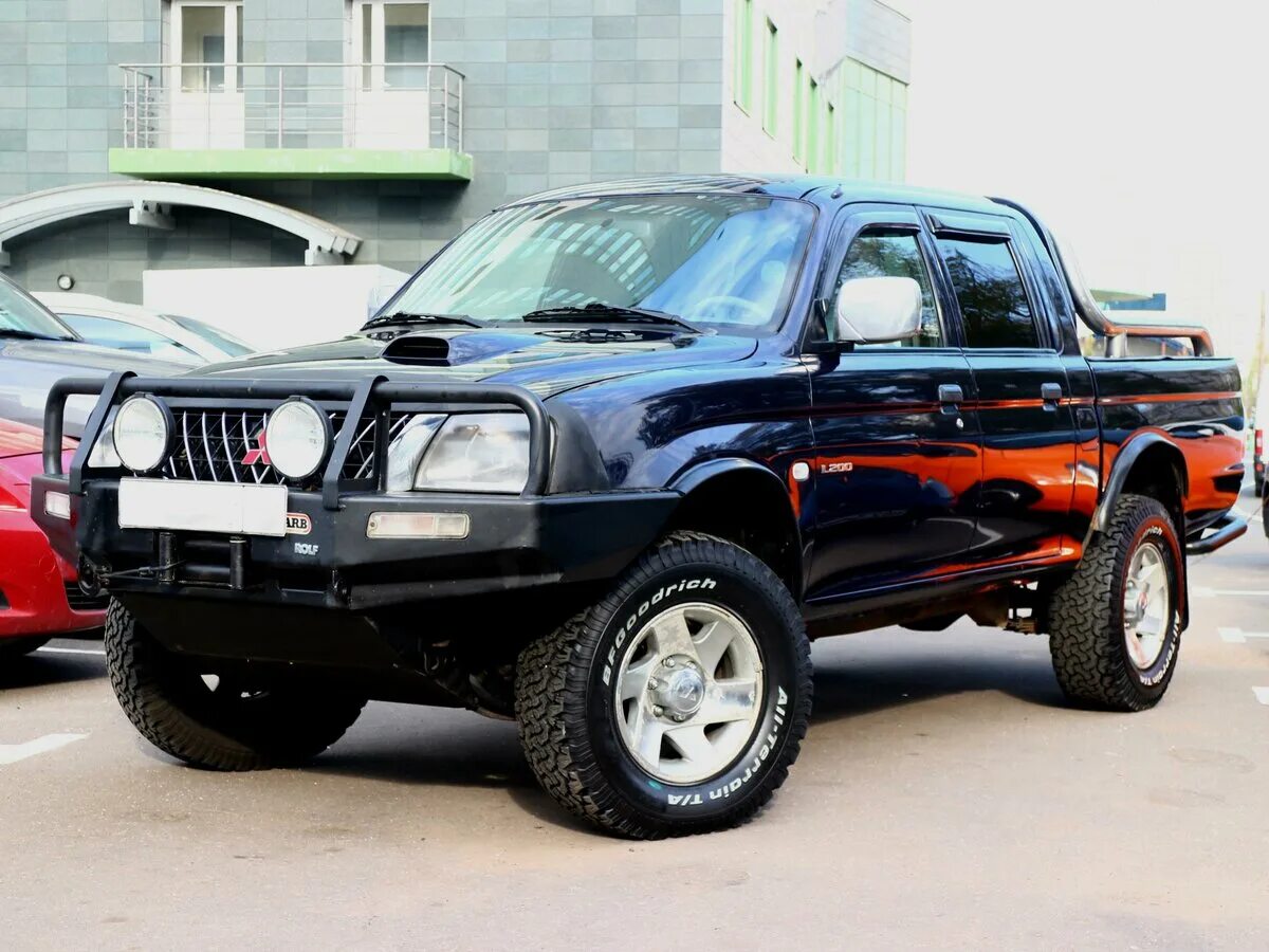 Митсубиси л200 2005. Mitsubishi l200 2 поколение. Мицубиси l200 2005.