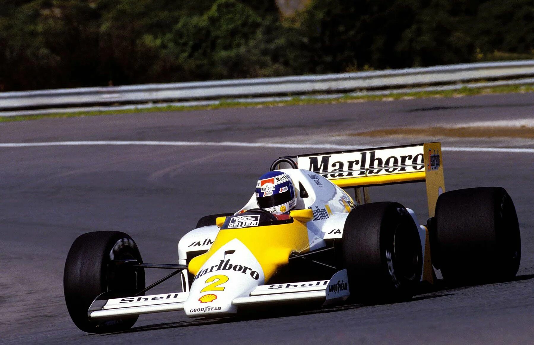 Прост формула 1. F1 1986 MCLAREN. Макларен ф1 Marlboro. Формула 1 Кеке Росберг. Макларен 1986.