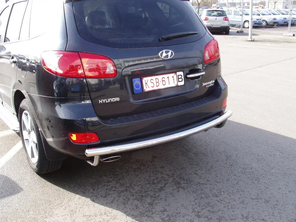 Задний бампер санта фе 2. Защита заднего бампера hyundai santa fe. защита бампера заднего санта фе 2006. защита заднего бампера хендай санта фе 2. защита бампера дуга hyundai santa fe 2.