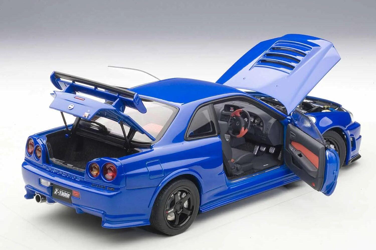 Модели 1 36. 1:18 Nissan Skyline gt-r r34. Nissan Skyline GTR r34 Toy. Nissan Skyline GTR r34 игрушка. Nissan Skyline r34 модель.