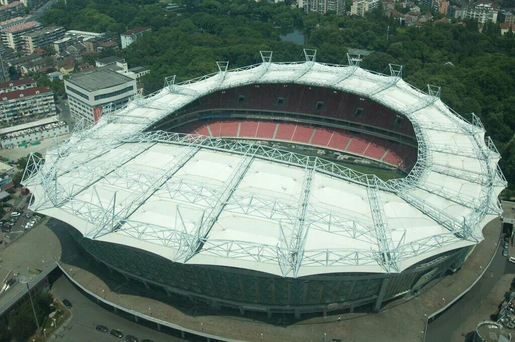 Стадионы китая. Стадион Хункоу. Шанхай стадион. Шанхай футбольный стадион. Чэнду стадион.