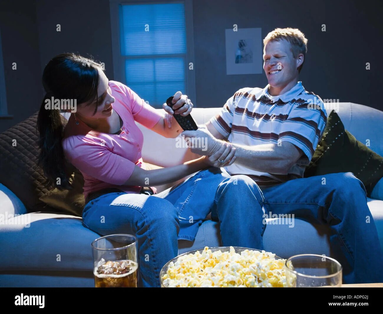 Fight control. Man with remote and chips watching tv at home. the remote control of life movie. a guy looking for a remote control. girl and 2 boys fighting for remote control.