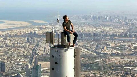 Tom Cruise sits on top of the Burj Khalifa in Dubai (Picture: Twitter) .