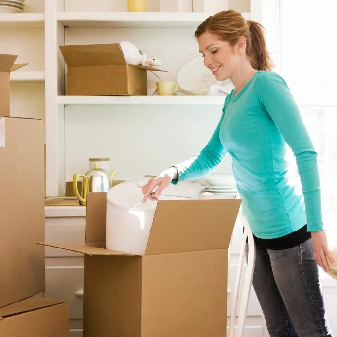 Removing day. Woman Unpacking. Fragile Storage devices. Fragile item transport services. Fragile items Packing things.