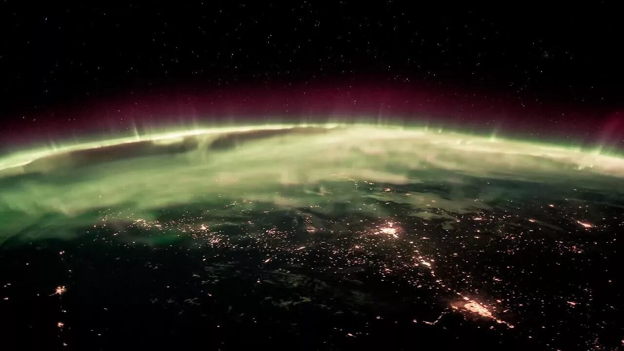 Earth from the International Space Station with Aurora Borealis over the coast o