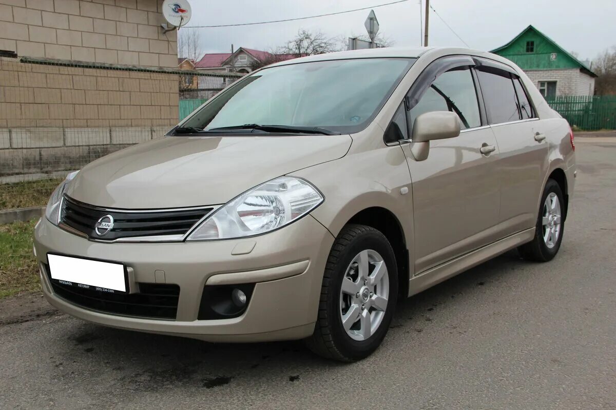 Купить б/у Nissan Tiida I Рестайлинг 1.6 AT (110 л.с.) бензин автомат в Москве: 