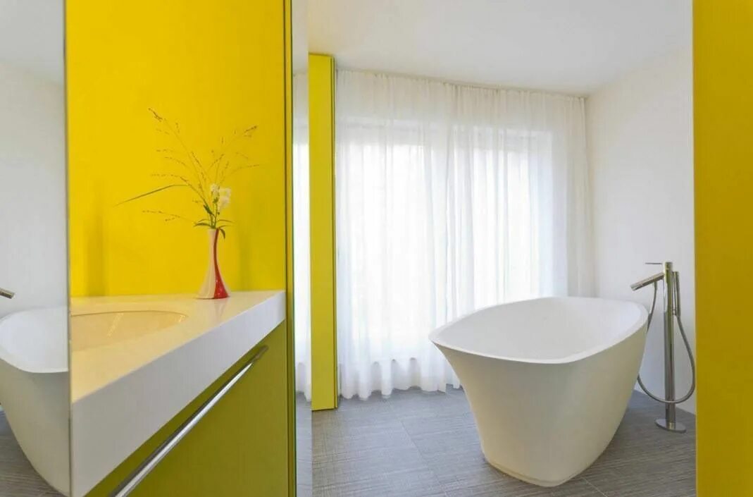 A yellow mustard tone paint with golden elements offers a lively touch to the ne