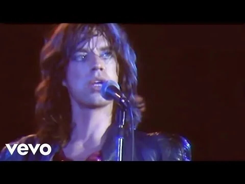 Rolling stones black and blue. Rolling stones with flowers. Mick jagger live. The rolling stones - grrr live. Мик тейлор фото.