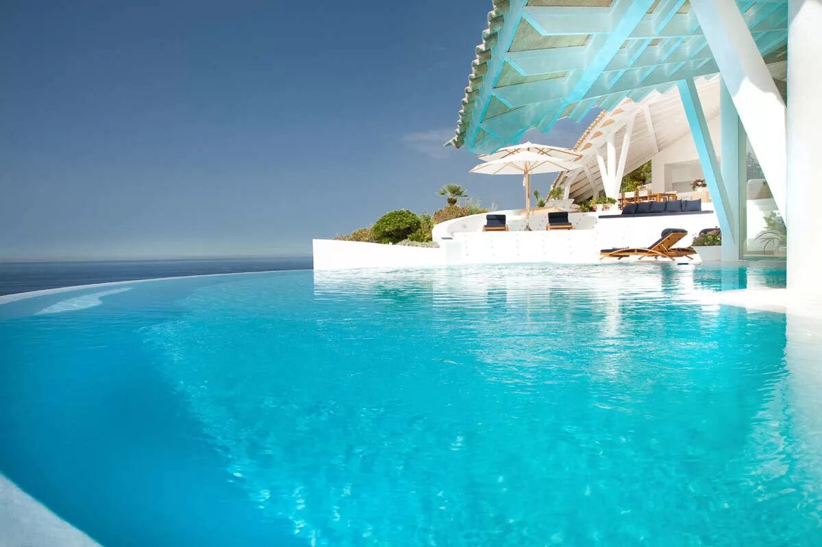 Мальдивы резорт лакшери. Море с бассейном. Rangali island, мальдивы бассейн. Santorini отель греция. Fregate island.