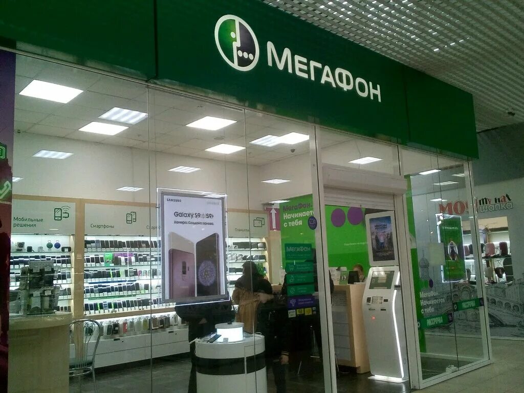 Салон мегафон внутри. Магазин мегафон лого. Мегафон телефоны красноярск. Телефон мегафона красноярск. Ближайший салон связи мегафон.