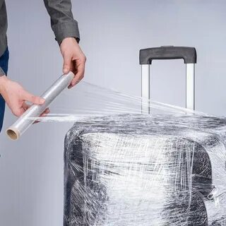 Обмотать чемодан пленкой