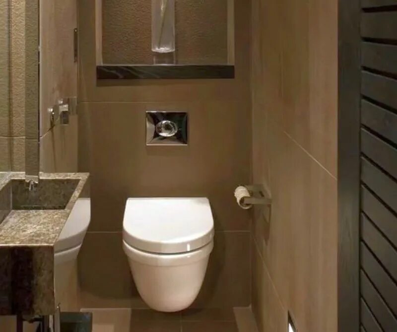 Полную версию туалет. Унитаз со встроенным бачком. Унитаз встроенный в стену. Встраиваемый туалет. Туалет с бачком в стене.