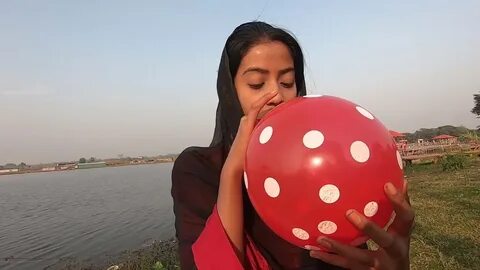 Girl pop balloons