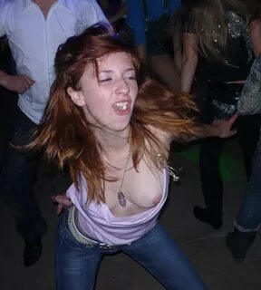 In an open dress and accidentally exposing her nipples on a dance floor.