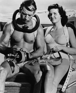 Shown getting ready for a movie sequence in Underwater, are Jane Russell an...