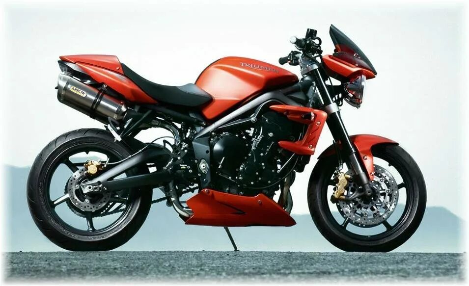 Триумф 2011. Мотоцикл триумф стрит трипл. мотоцикл triumph 675 triple. мотоцикл triumph street triple 675. triumph street triple 675 2011.