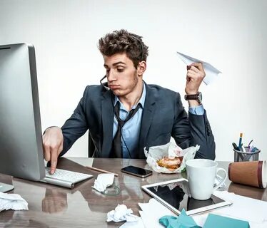 Young Office Man With Paper Plane In His Hand Typing On A Comput 