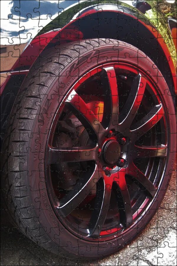 Черная краска для дисков авто. Колесо спортивного автомобиля. Машина с красной резиной. Цветная детали на колесе. Покрасить покрышки.