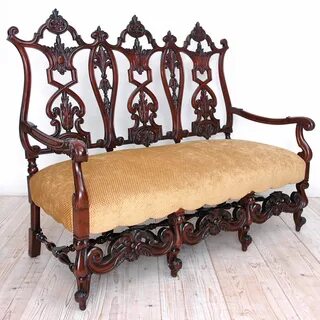 Gilded Age American Neo-Gothic Carved Settee in Mahogany, circa 1890.