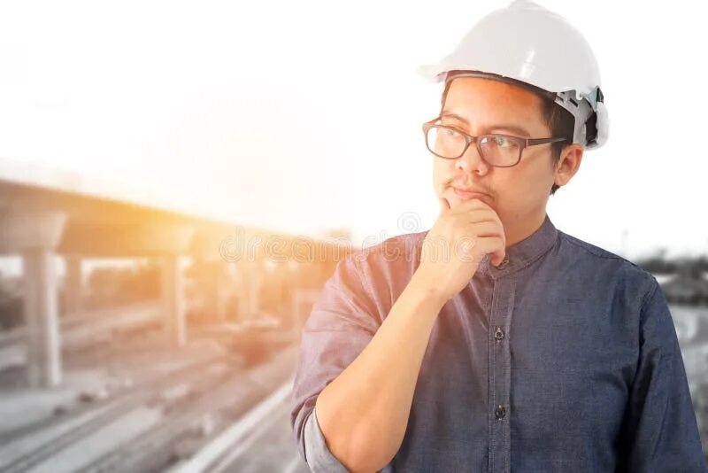 Her are engineers. Инженер думает. Инженер задумался. Человек Думающий инженер. Азиатский инженер.