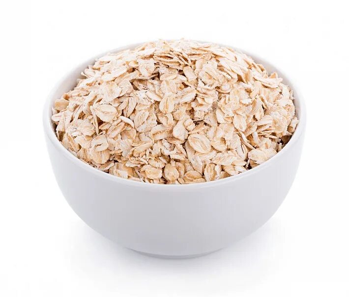 овсяная каша. белая овсянка. крупа из овса. овсяные хлопья на белом фоне. порридж.