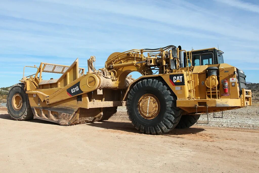 Катерпиллер 631g. Скрепер Катерпиллер. Cat 631g. Скрепер Caterpillar 637f. Скрейпер