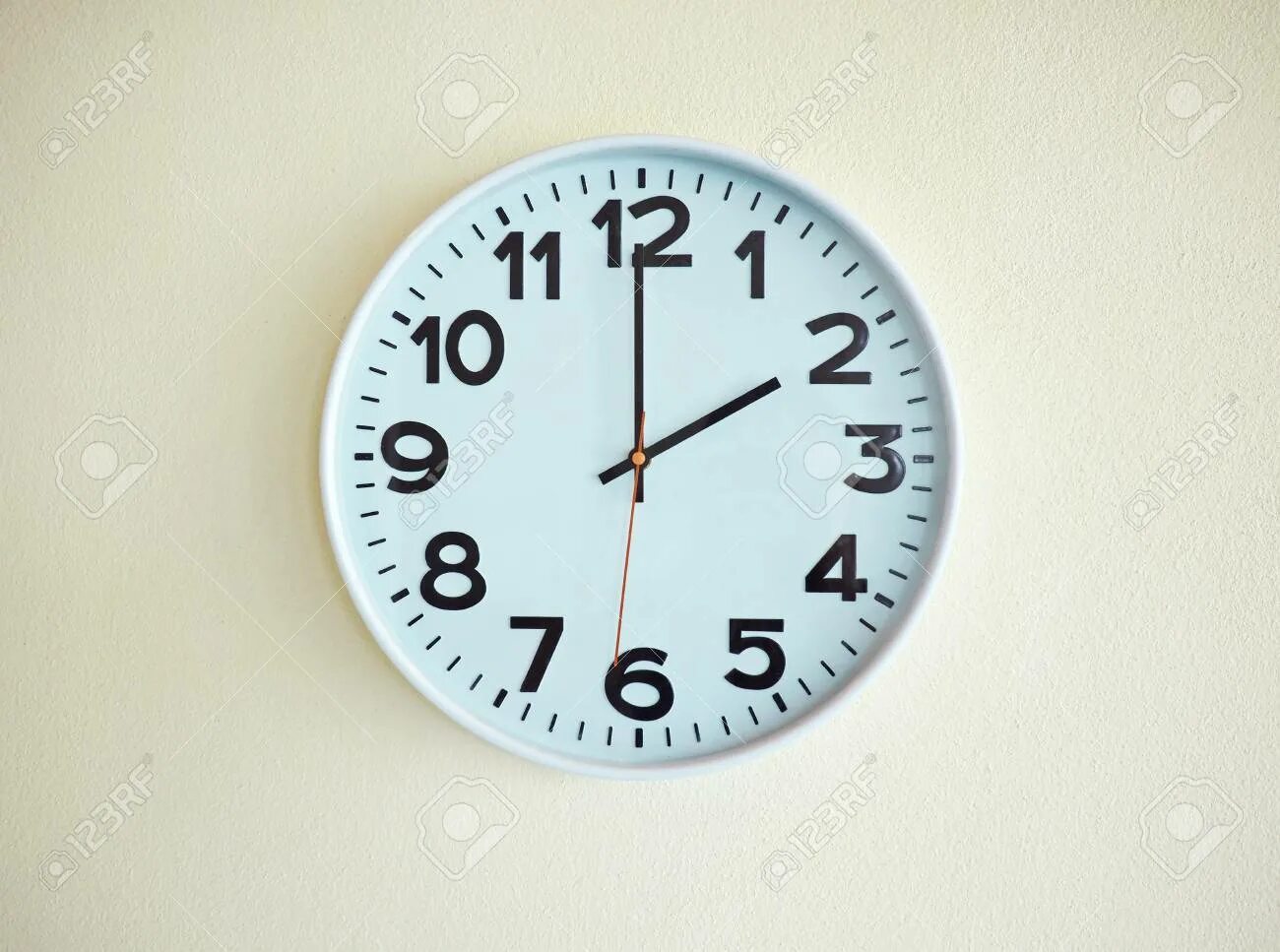 Be on the clock. Clock on the wall. the clock is on the wall. analog clock on the wall that says. clock on 9 a.m.