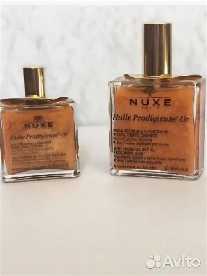 Nuxe масло с шиммером. Духи nuxe huile prodigieuse or. Летик масло с шимером. Масло nuxe с блестками. Nuxe масло с шиммером.