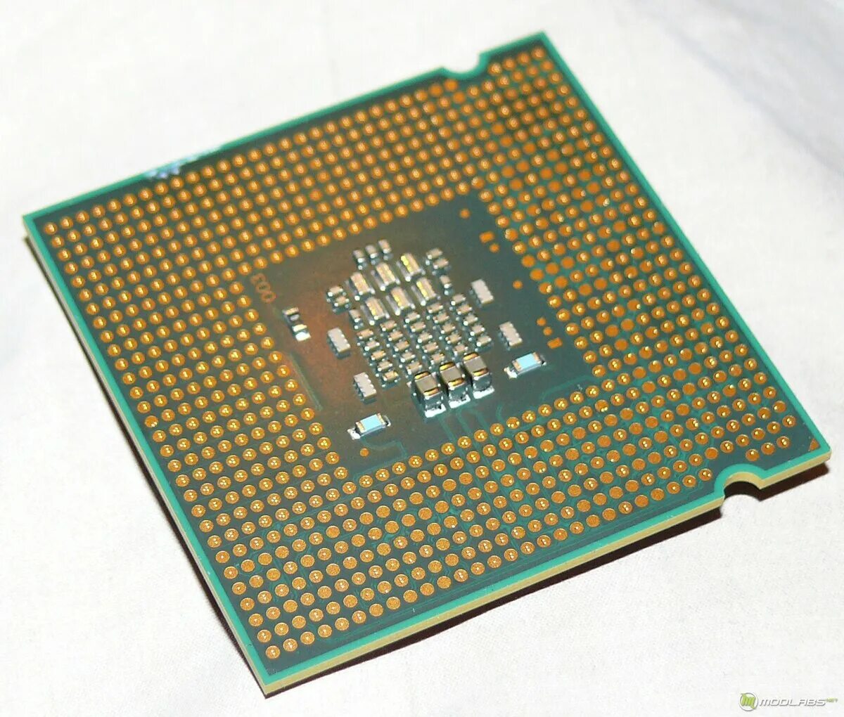 Процессор 1200 список. Процессор Intel Celeron e1200. Интел Celeron e1200 сокет. Процессор Intel снизу. Intel Celeron 1200mhz.