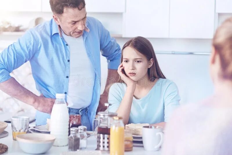 Daughter on dad talk. A guy yelling at his daughter. Father daughter home