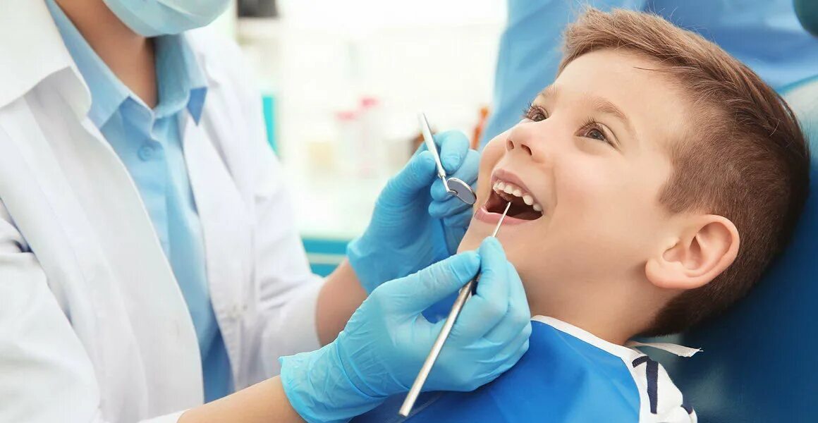 осмотр стоматолога в школе