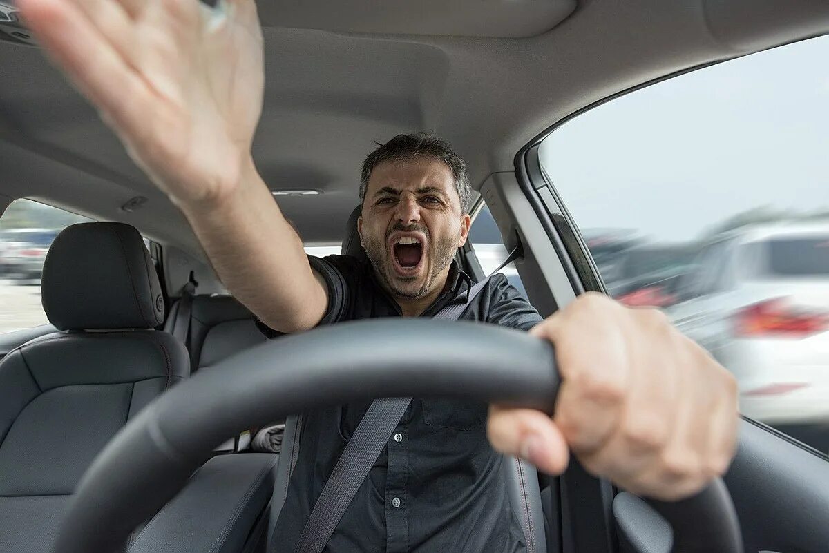 He doesn t driving. Агрессивный водитель. Человек за рулем. Водитель за рулем. Мужчина за рулем.