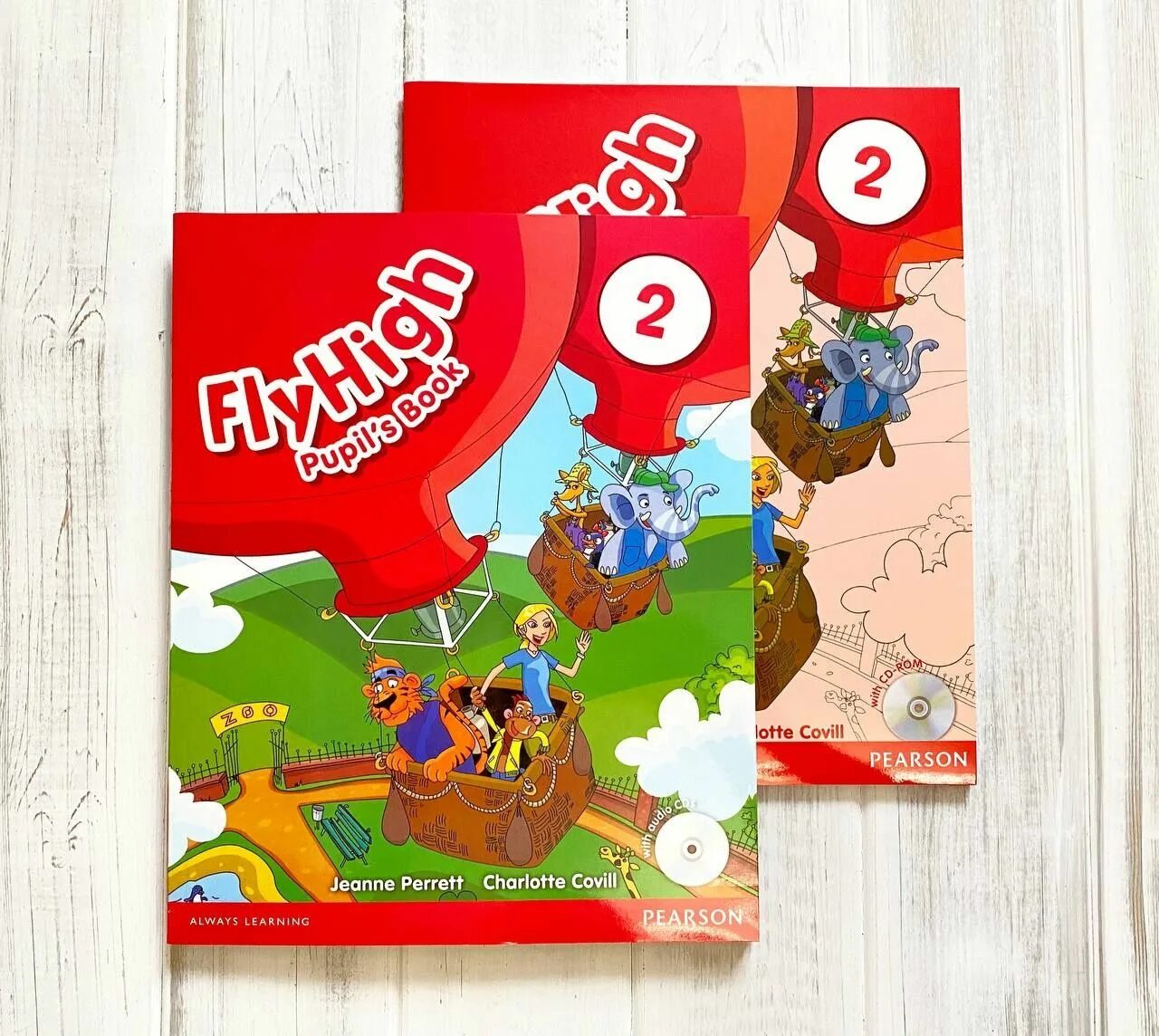 We fly high. Flyhigh pupil's book 2. Fly High 2 activity book. Fly High учебники. Учебник английского Fly High.